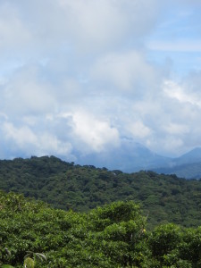 Arenal Volcano in the distance behind the clouds on the left-hand side.